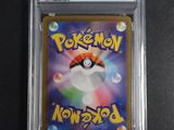 a close up of a pokemon card on a table