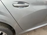 a close up of a car door handle with a sticker on it