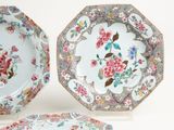 three plates with different designs on them on a white surface