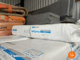 a stack of boxes of cement sitting on top of a pallet
