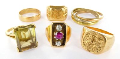 several different types of gold rings and rings on a white surface