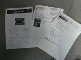 several papers are sitting on the ground next to each other