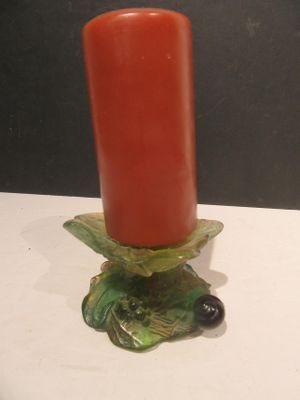 candlestick holder in the shape of a turtle with a red candle
