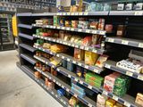 a lot of food on the shelves in the store