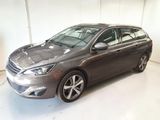 a picture of a grey car parked in a garage