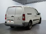 a white van that is parked in a room