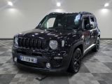 the black jeep is parked in the garage on a checkered floor