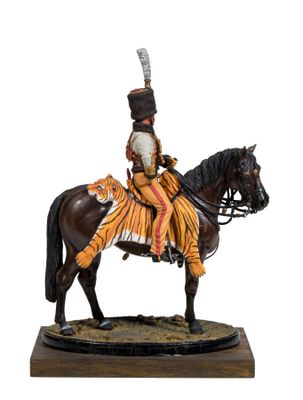 statue of a man on a horse with a feather on his head