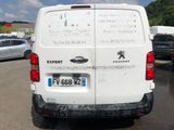 a white van that is parked in a parking lot