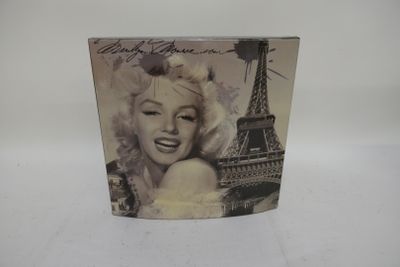 the marilyn monroe album is on display on a white surface