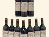 plusieurs bouteilles de vin sont alignées sur une surface blanche