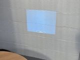 a laptop computer sitting on top of a wooden table