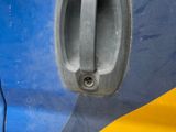 a close up of a door handle on a blue and yellow car