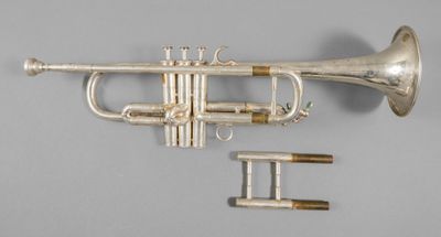 an old silver trumpet with a brass bell and two keys