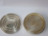 pair of silver plated coasters with mother of pearl inlays