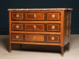 an antique chest of drawers with marble top and brass pulls