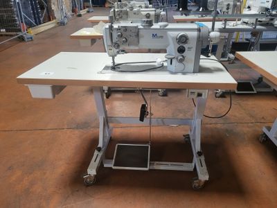 an image of a sewing machine sitting on top of a table