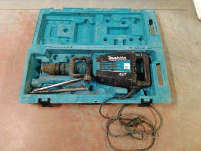 a blue tool box with tools in it on the floor