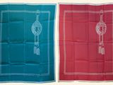 two different colored bandas with tassels on them