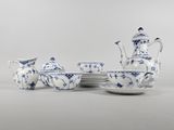 blue and white porcelain tea set with cups and saucers