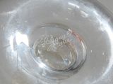 a close up of a clear glass vase with a label on it