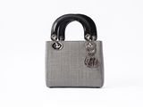 a close up of a purse with a handle on a white background