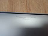 a close up of a laptop on a wooden table
