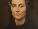 portrait of an old woman in a black dress