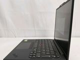 a black laptop computer sitting on a white surface