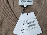 a picture of a brown sweater with a tag on it
