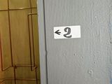 a sign on the door of a bathroom that says 9