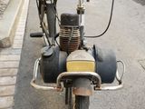 a motorcycle that is parked on the side of the street