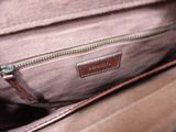 a close up of a purse with a zipper on it