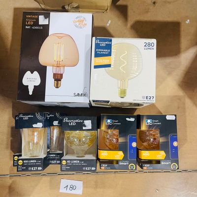 many different types of light bulbs on display in a store