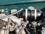 a close up of the engine of a green car