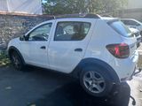 a picture of a white car parked in a parking lot