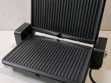 an image of an electric grill on a white table