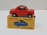 a red toy car sitting on top of a yellow box