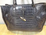 an image of a handbag with a lock on it