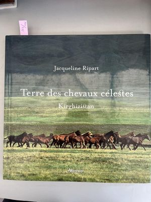 a picture of a book with horses running in a field