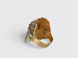an image of a gold ring with a head of an indian chief
