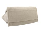 beige canvas toiletry bag on a white background with a white background