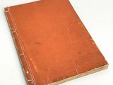 an old book that is sitting on a table