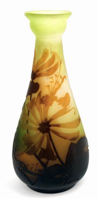 a vase that has a yellow and black design on it