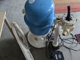 an image of a room with a blue water tank and other items
