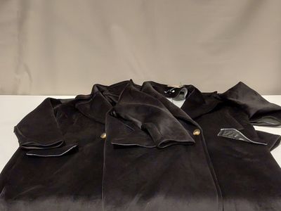 black jacket on a white table with a white background