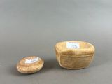 two small wooden bowls and a small wooden bowl on a gray surface
