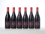 six bottles of red wine lined up in a row