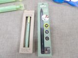 a box of toothbrushes sitting on a table next to a pair of scissors