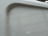 a close up of a white truck with a window